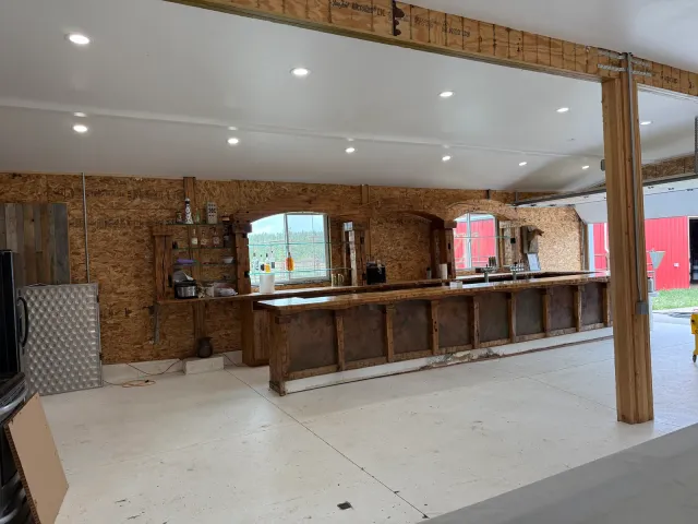 Long bar and timber post in the open remodeled room