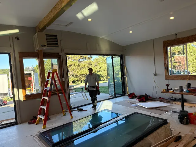 Crew installing doors and windows during the remodel