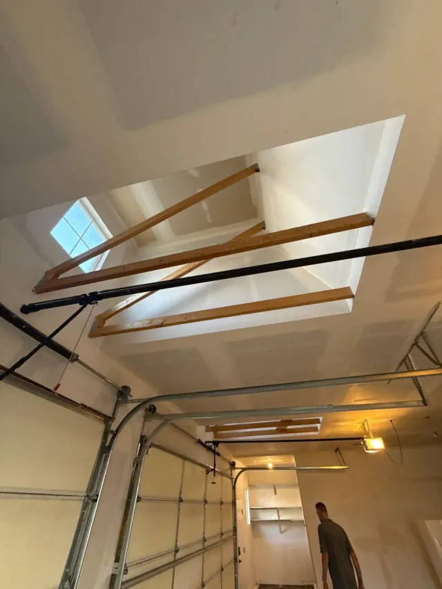 Skylight wells framed and drywalled in a garage ceiling