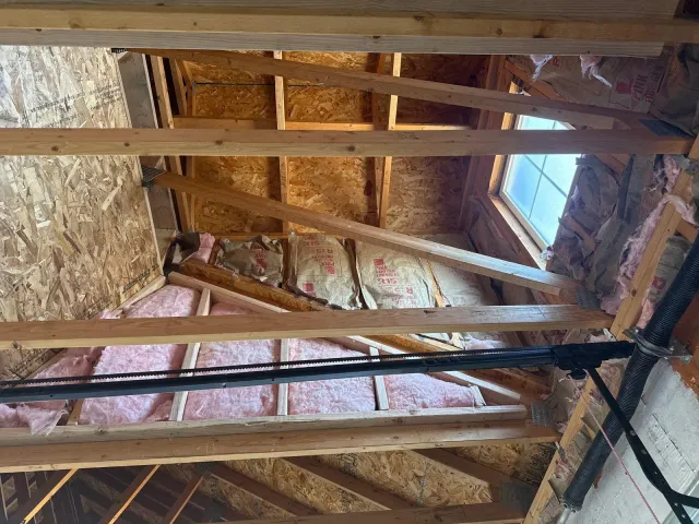 Insulation installed between garage roof framing