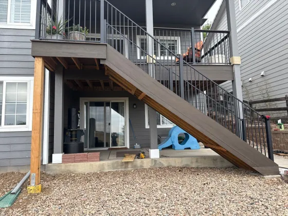 Exterior stair from the upper deck down to the walkout patio